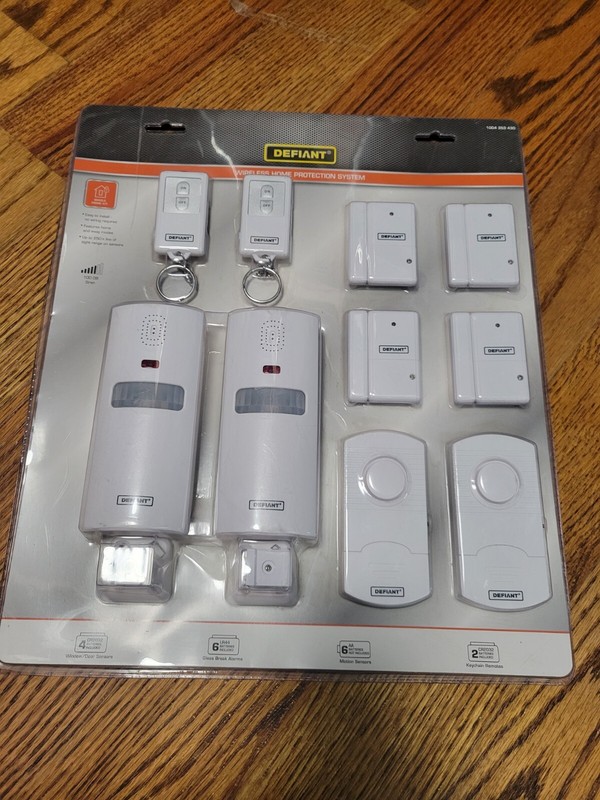 (1) New Defiant Wireless Home Protection System: 4 Window/door, 2 Motion, 2 Glas